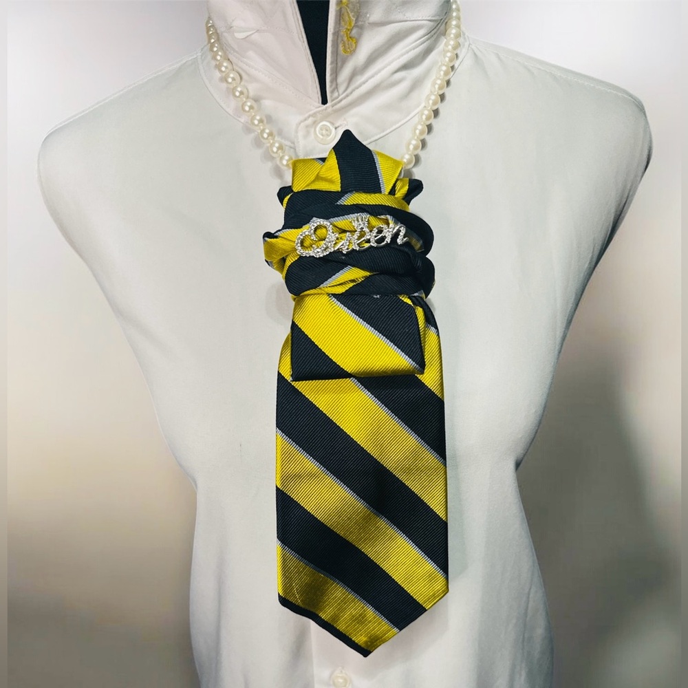 Elegant Navy Blue and Yellow Striped Necktie with Queen Brooch